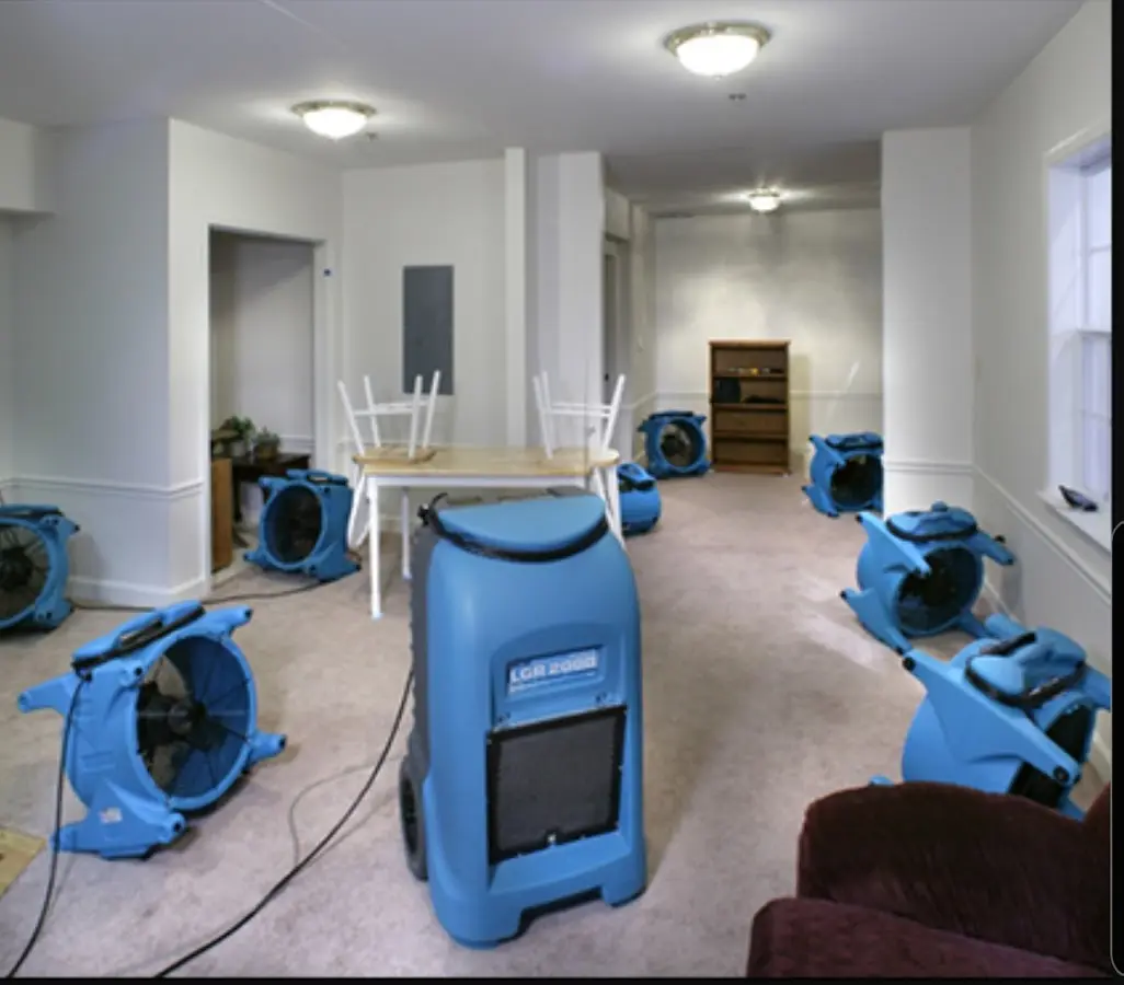 Air movers and dehumidifier setup for Water Damage Restoration in Chelsea